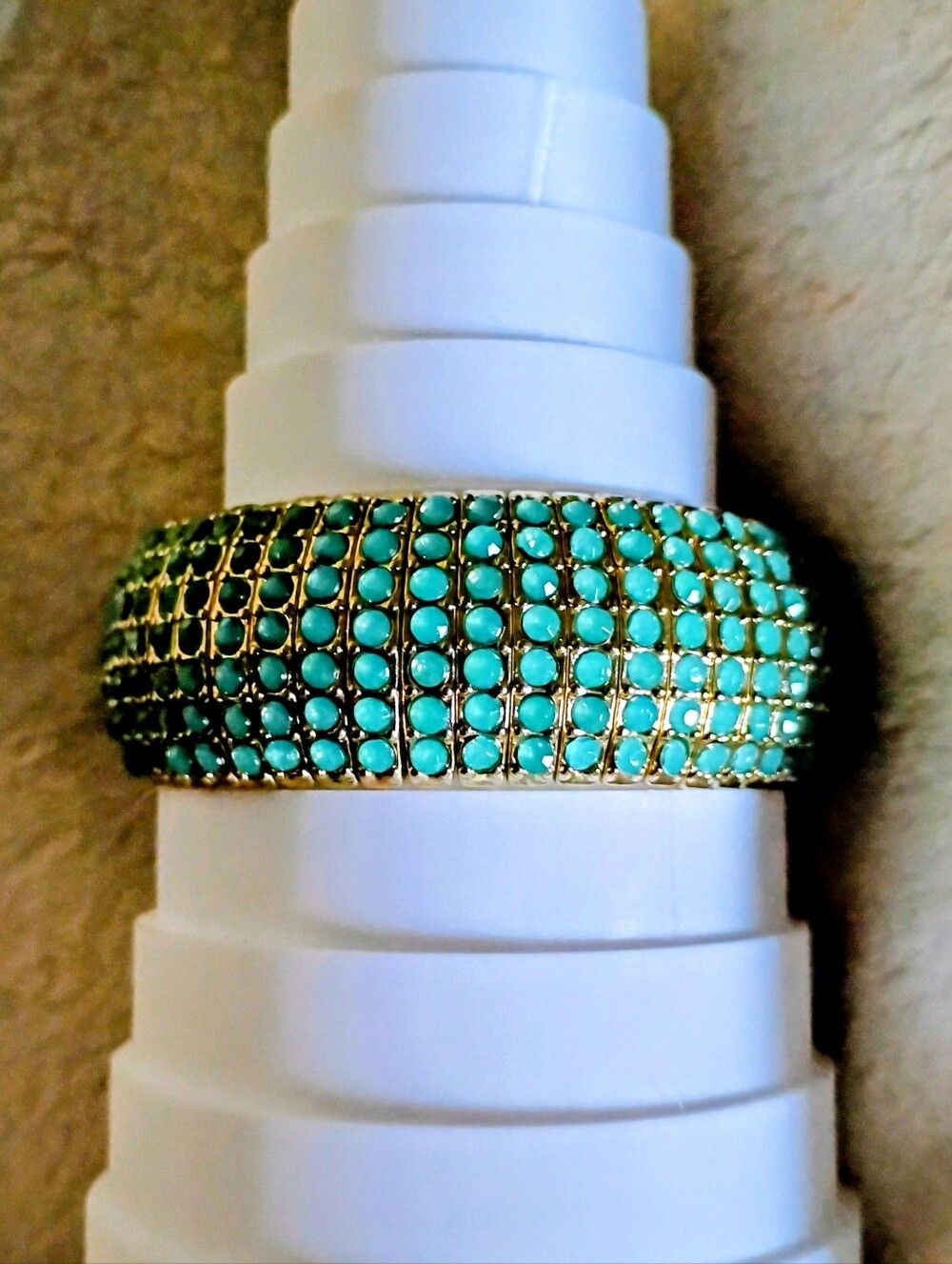 This is a wide stretch bracelet with Turquoise colored Stones